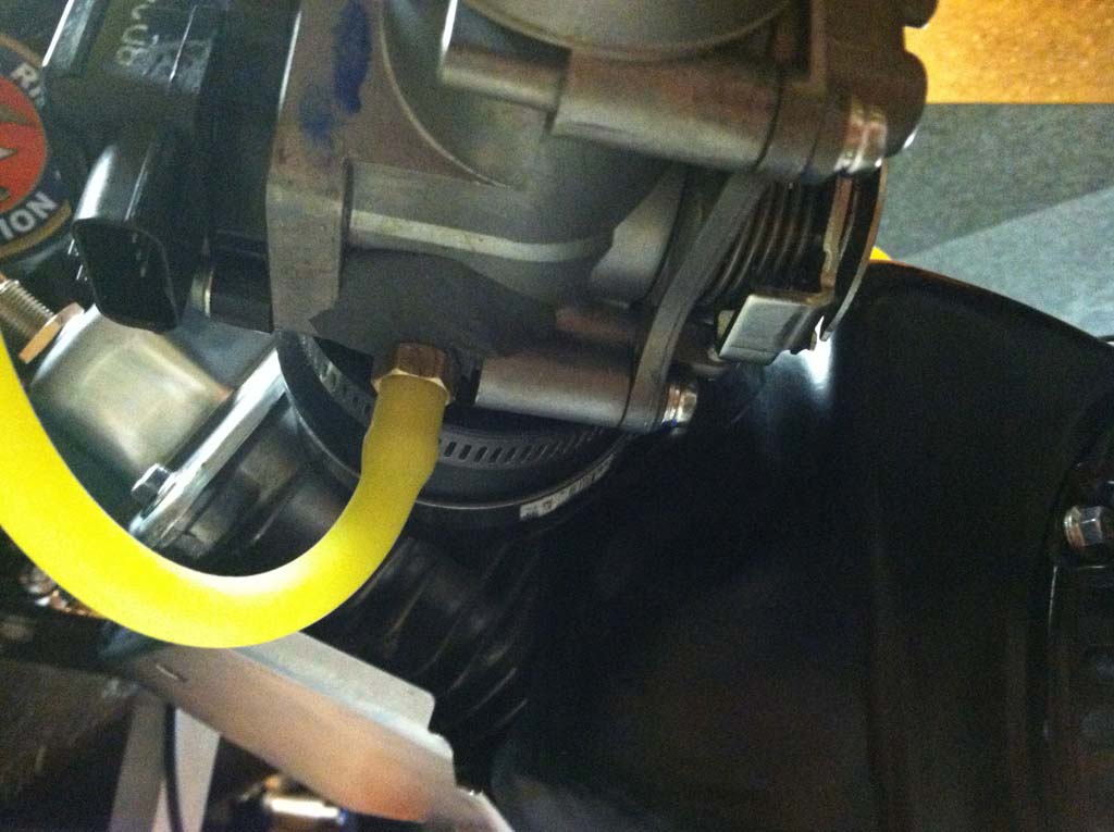 Image of pressure reference port I installed on the Honda 250r fuel injection throttle body.